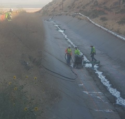 Workers in Drainage Ditch